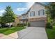 Charming two-story home boasts stone accents, well-manicured landscaping, and a welcoming front porch at 2127 Apple Orchard Way, Austell, GA 30168