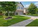 A beautifully landscaped front yard complements this two-story home with a stone and siding facade at 2127 Apple Orchard Way, Austell, GA 30168
