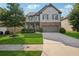 Charming two-story home with manicured lawn and stone accents, creating inviting curb appeal at 2127 Apple Orchard Way, Austell, GA 30168