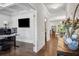 Stylish home office featuring wainscoting, hardwood floors, coffered ceiling, and an abundance of natural light at 2127 Apple Orchard Way, Austell, GA 30168