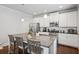 Well-equipped kitchen with stainless steel appliances, granite countertops, and a functional island with barstool seating at 2127 Apple Orchard Way, Austell, GA 30168