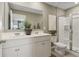 Modern bathroom with double vanity, large mirror, and a glass-enclosed shower at 2363 Haran Dr # 35, Lithonia, GA 30058
