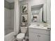 Bathroom featuring a white vanity, toilet, shower with white curtain and tasteful wall decor at 2363 Haran Dr # 35, Lithonia, GA 30058