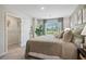 Inviting bedroom with large windows, ensuite closet, neutral tones and comfortable furnishings at 2363 Haran Dr # 35, Lithonia, GA 30058
