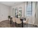 Elegant dining room with sleek table, neutral chairs, and decorative mirrors at 2363 Haran Dr # 35, Lithonia, GA 30058