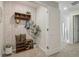 Hallway features coat rack with decorations and storage with quick access to the front door and staircase at 2363 Haran Dr # 35, Lithonia, GA 30058