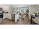 Open-concept kitchen features stainless steel appliances and granite countertops seamlessly flowing into the living area at 2363 Haran Dr # 35, Lithonia, GA 30058