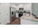 Modern kitchen with stainless steel appliances, granite countertops, and ample cabinet space at 2363 Haran Dr # 35, Lithonia, GA 30058