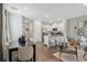 An open concept kitchen and dining area lead into the naturally lit living room in this modern home at 2363 Haran Dr # 35, Lithonia, GA 30058