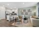 Open-concept living room featuring modern decor, stylish furniture, and a breakfast bar connected to the kitchen at 2363 Haran Dr # 35, Lithonia, GA 30058