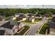 An aerial view of a residential neighborhood featuring tree-lined streets and single-Gathering homes at 4676 Shaded Oak Ln, Forest Park, GA 30297