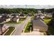 An aerial view of a quiet residential neighborhood with well-maintained homes and manicured lawns at 4676 Shaded Oak Ln, Forest Park, GA 30297