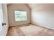 Neutral bedroom with carpet and a window, bathed in natural light at 4676 Shaded Oak Ln, Forest Park, GA 30297