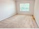 Neutral bedroom with carpet and a window at 4676 Shaded Oak Ln, Forest Park, GA 30297