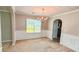 Traditional dining room with wainscoting and a chandelier at 4676 Shaded Oak Ln, Forest Park, GA 30297