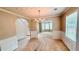 Traditional dining room with wainscoting and a chandelier overlooking the living room at 4676 Shaded Oak Ln, Forest Park, GA 30297