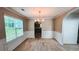 Traditional dining room with wainscoting and a chandelier at 4676 Shaded Oak Ln, Forest Park, GA 30297