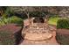 Stone sign for Crown River neighborhood with lush landscaping and mature trees on a sunny day at 4676 Shaded Oak Ln, Forest Park, GA 30297