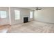 Bright living room with a fireplace and a ceiling fan at 4676 Shaded Oak Ln, Forest Park, GA 30297