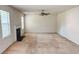 Spacious living room with a fireplace and ceiling fan at 4676 Shaded Oak Ln, Forest Park, GA 30297