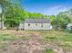 A view of the backyard showcasing the grassy area and the fence surrounding the property at 118 Greenwood St, Fairburn, GA 30213