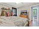 Bright main bedroom featuring hardwood floors, closet space, and natural light at 118 Greenwood St, Fairburn, GA 30213