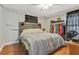 Inviting bedroom with a platform bed, wooden headboard, and ample closet space at 118 Greenwood St, Fairburn, GA 30213