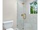 Shower features marble style tile and glass door at 3564 Liberty Ln, Marietta, GA 30062