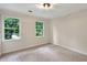 Neutral bedroom with two windows allowing for plenty of natural light at 3564 Liberty Ln, Marietta, GA 30062