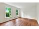 Bright bedroom with hardwood floors and large windows offering natural light at 3564 Liberty Ln, Marietta, GA 30062