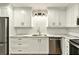Modern kitchen featuring white cabinets, stainless steel appliances, and subway tile backsplash at 3564 Liberty Ln, Marietta, GA 30062