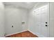 Laundry room features wood flooring and a white entry door at 3564 Liberty Ln, Marietta, GA 30062