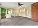 The screened-in porch features a ceiling fan, brick accent wall, and exterior doors with wall sconces at 3564 Liberty Ln, Marietta, GA 30062