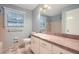 Bathroom featuring a shower, vanity with sink, patterned tile floor, and natural light at 421 Fond Du Lac Dr, Stone Mountain, GA 30088