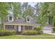 Charming brick home with dormer windows and a two-car attached garage at 421 Fond Du Lac Dr, Stone Mountain, GA 30088