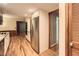Bright kitchen with stainless appliances, wooden floors, and pantry door at 421 Fond Du Lac Dr, Stone Mountain, GA 30088