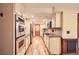 Bright eat-in kitchen with stainless steel appliances, granite countertops, and hardwood floors at 421 Fond Du Lac Dr, Stone Mountain, GA 30088