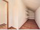 An empty storage area with hardwood floors and shelving at 421 Fond Du Lac Dr, Stone Mountain, GA 30088