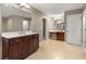 Spacious bathroom featuring dual vanities, tile flooring, and stylish fixtures for a luxurious feel at 5761 E Emerald Oaks Ln, Acworth, GA 30102