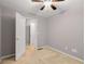 Bedroom showcasing modern gray walls, cozy carpet, and ample natural light from the window at 5761 E Emerald Oaks Ln, Acworth, GA 30102