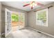 Bedroom with access to a private deck and backyard view at 5761 E Emerald Oaks Ln, Acworth, GA 30102