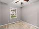 Bedroom offering neutral walls, comfortable carpeting, and a window for natural light at 5761 E Emerald Oaks Ln, Acworth, GA 30102