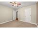 Bedroom featuring soft carpet and a pair of doors providing convenient access to other rooms at 5761 E Emerald Oaks Ln, Acworth, GA 30102