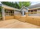 Large wooden deck with multiple levels and stairs, perfect for outdoor gatherings at 5761 E Emerald Oaks Ln, Acworth, GA 30102