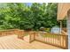 Large wooden deck offering views of the well-maintained, tree-lined backyard at 5761 E Emerald Oaks Ln, Acworth, GA 30102