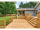 Expansive backyard deck with stairs and railings, perfect for outdoor living and entertaining at 5761 E Emerald Oaks Ln, Acworth, GA 30102
