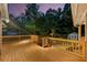 Wood deck with railings overlooking a backyard with a shed and fire pit at 5761 E Emerald Oaks Ln, Acworth, GA 30102
