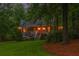 Charming home exterior with a vibrant red front door and well-maintained landscaping at 5761 E Emerald Oaks Ln, Acworth, GA 30102