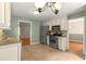 Functional kitchen with stainless appliances, abundant cabinetry, tile flooring, and convenient layout at 5761 E Emerald Oaks Ln, Acworth, GA 30102