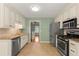 Well-appointed kitchen featuring stainless steel appliances, granite countertops, tile backsplash and travertine flooring at 5761 E Emerald Oaks Ln, Acworth, GA 30102